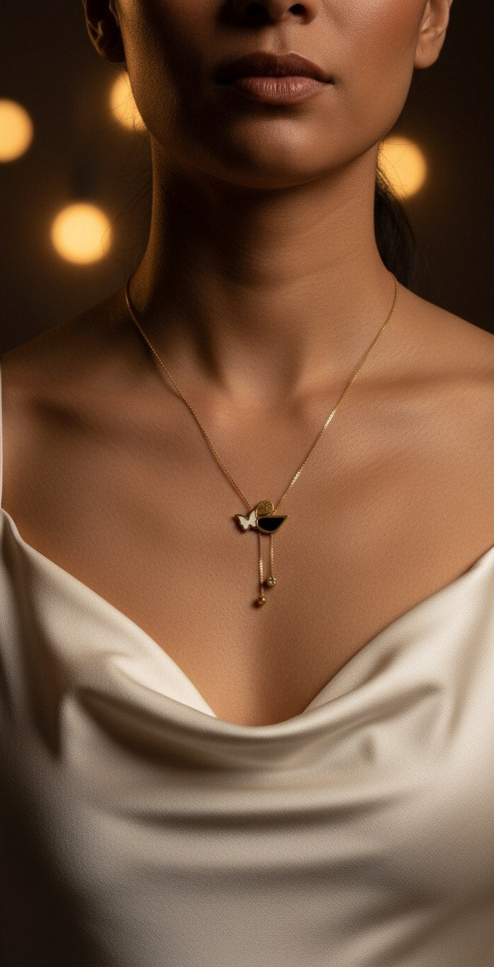 Woman wearing a gold necklace with a blurred background