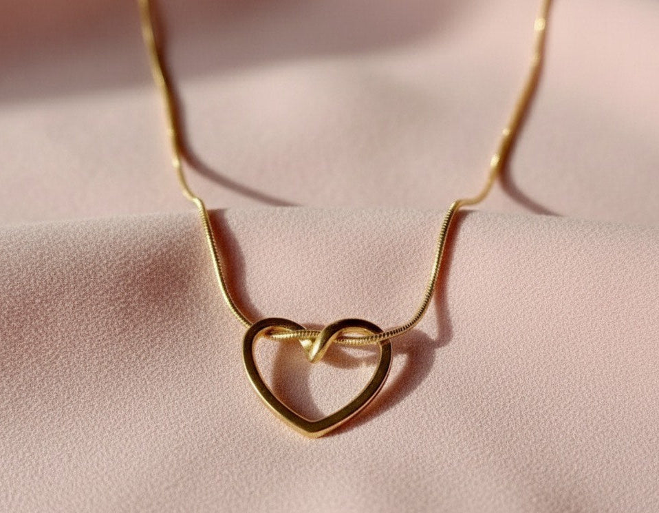 "This necklace offers bold, feminine elegance with a fashionable edge. Featuring a delicate Y-drop design, four intricately textured gold heart charms cascade gracefully, instantly lengthening your silhouette. Crafted from durable material with a tarnish-free golden finish that stays brilliant. It's the perfect modern statement piece for any neckline.
"
