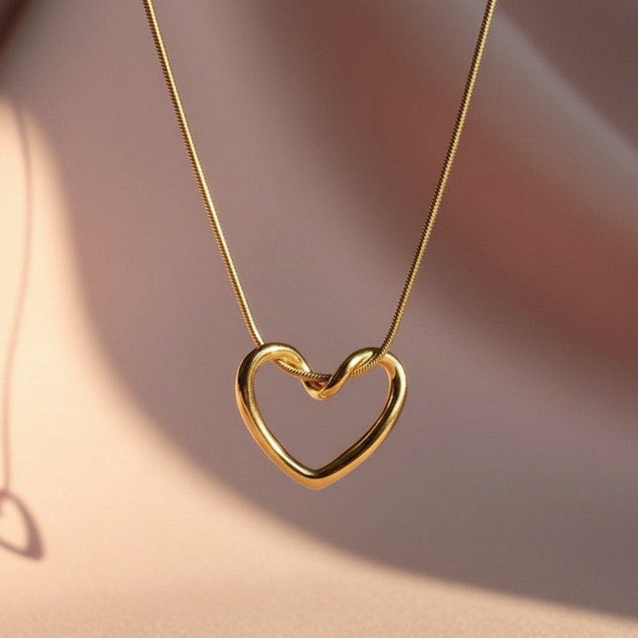 "This necklace offers bold, feminine elegance with a fashionable edge. Featuring a delicate Y-drop design, four intricately textured gold heart charms cascade gracefully, instantly lengthening your silhouette. Crafted from durable material with a tarnish-free golden finish that stays brilliant. It's the perfect modern statement piece for any neckline.
"
