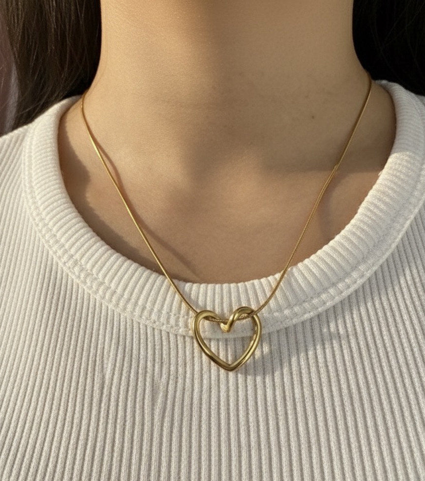"This necklace offers bold, feminine elegance with a fashionable edge. Featuring a delicate Y-drop design, four intricately textured gold heart charms cascade gracefully, instantly lengthening your silhouette. Crafted from durable material with a tarnish-free golden finish that stays brilliant. It's the perfect modern statement piece for any neckline.
"
